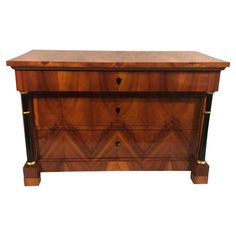 a wooden chest with two drawers on one side and an open drawer on the other