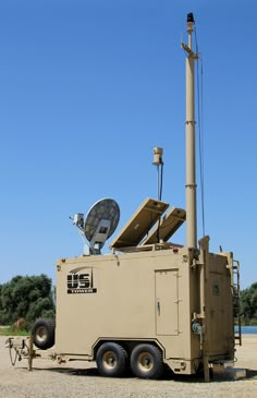 an army vehicle with a satellite dish on top