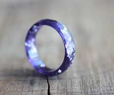 * ONE purple resin ring from my resin jewelry collection * resin band ring - 4-5 mm/0.16 - 0.19 inches/width  * thickness - about 2.3 - 2.5 mm/about 0.09 inches/ * faceted ring with unique flakes pattern * color is gemstone inspired - purple ring with silver flakes/leaf - this ring was inspired by Amethyst and resembles the color and shine of the precious stone. The resin color and texture looks like a real Amethyst and ads sparkle to your look. You can see the other resin rings from the collection here: https://www.etsy.com/shop/ARTISUNtis?ref=seller-platform-mcnav&section_id=15714637 Features: * Hypoallergenic ring (suitable for the people with metal allergy) * For everyday and for special occasions * Perfect gift for you or for the special one in your life  * Stacking ring - you can wea Sparkly Rings, Crystal Clear Epoxy Resin, Purple Resin, Purple Ring, Resin Rings, Faceted Ring, Clear Epoxy Resin, Purple Rings, Stacking Bands