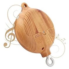 a wooden speaker with musical notes attached to it's side and an earpiece in the shape of a music note