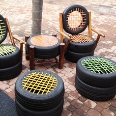 four chairs and two tables made out of old tires