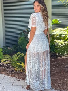 Bohemian V-neck, split embroidered lace dress, resort white maxi dress Delicate Lace V-neck Dress For Brunch, Beach V-neck Lace Dress, White Flowy V-neck Maxi Dress, Lace V-neck Maxi Dress For Summer, Bohemian V-neck Maxi Dress With Lace Patchwork, Summer Midi Maxi Dress With Lace Trim, Floor-length Dress For Brunch During Beach Season, Short Sleeve Lace Maxi Dress With Lace Patchwork, Short Sleeve Lace Maxi Dress With Patchwork