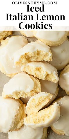 iced italian lemon cookies with white icing on a sheet of parchment paper and text overlay