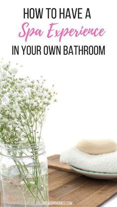 a jar with flowers in it and the words how to have a spa experience in your own bathroom