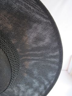 "* This black Sinamay hat form has a 12\" diameter and has a subtle and sophisticated animal print enhanced with the spectator feathered butterflies. The band is a woven braid and coordinates with the subdued hat print. * The hat has been designed to sit on either side of the head with an acrylic headband. * Upon ordering this is the exact hat you will receive. * Perfect to wear to any Special Event or Celebration, Ladies Luncheon, Derby Parties, Weddings, Wedding or Baby Shower, Anniversary, Fa Black Cloche Hat For Kentucky Derby And Beach, Black Woven Wide Brim Hat, Black Wide Brim Woven Hat, Black Brimmed Boater Hat For Church, Black Woven Sun Hat With Flat Brim, Fitted Black Sinamay Hat, Black Fitted Sinamay Hat, Black Woven Flat Brim Sun Hat, Chic Black Woven Hat