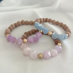 Materials: Rose Quartz, Aquamarine, Amethyst, Rosewood, Hematite and Elastic cord Size Options: 6,  6.5, 7 or 7.5 inches Bead Size: Wooden Beads 8mm, Gemstone 10mm Please select the bracelet length 6, 6.5, 7 or 7.5 inches in the length box or if you would like to have different length, please let us know:)  This bracelet would be a perfect gift for friends, family, someone special  or yourself:) We use gemstones, freshwater pearls, corals, shells, feathers etc. for our creations. This may result E Jewelry, Oil Diffuser Bracelet, Essential Oil Diffuser Bracelet, Rose Bracelet, Rose Quartz Bracelet, Diffuser Bracelets, Quartz Bracelet, Quartz Rose, Bracelet Length