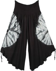 A cropped wide-leg pant. features smocked elastic waistband, 2 front tie pockets, and tie ruffle leg opening. A chic pair of wide-leg culotte pants in black with a white tie-dye that goes around the middle of the pants, back, and front. This style is totally fresh and you will be ahead of fashion. The front pockets come with a functional tie-up string that gives it a boho look. Similar functional tie-ups are attached at the bottom of these pants and can be pulled to make the leg opening higher. Summer Harem Pants With Drawstring, Summer Capri Length Wide Leg Pants With Elastic Waistband, Bohemian Drawstring Pants For Summer, Bohemian Summer Pants With Drawstring, Summer Bohemian Pants With Drawstring, Casual Tie-side Bottoms For Festival, Summer Drawstring Wide-leg Harem Pants, Summer Wide-leg Harem Pants With Drawstring, Bohemian Drawstring Harem Pants For Spring