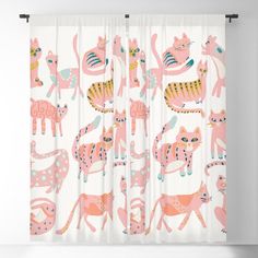 a curtain with pink and orange animals on it