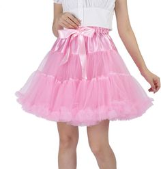 a woman wearing a pink tutu skirt with a bow around the waist and short sleeves