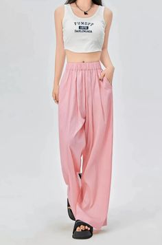 Discover effortless style with our Elastic Waist Pleated Trousers with Pockets – your new go-to for laid-back sophistication. Made with a luxurious blend of materials, these high-waisted trousers offer a loose fit that drapes beautifully for a relaxed silhouette. The pleated design and subtle pockets combine functionality with a touch of casual elegance, making them perfect for a seamless transition from office to evening. Pair these versatile trousers with a fitted blouse and heels for a profes Fitted Blouse, Seamless Transition, Pleated Trousers, High Waisted Trousers, Casual Elegance, Effortless Style, Elastic Waist, Loose Fitting, Trousers