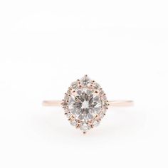 Vera Marquise Cut Moissanite Halo Ring For Formal Events, Formal Rose Gold Marquise Ring, Formal Diamond White Marquise Cut Halo Ring, Rose Gold Marquise Ring For Formal Occasions, Formal Diamond White Halo Ring, Marquise Cut, Formal Marquise Cut Diamond Ring With Halo Setting, Formal Marquise Rose Gold Ring, Formal Marquise Cut Halo Ring In Diamond White, Formal Heirloom Teardrop Diamond Ring