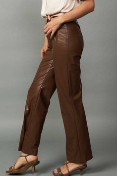 Faux leather straight leg pants. Available in chocolate brown. 55% Polyester, 45% Polyurethane Sleek Fitted Brown Leather Pants, Trendy Brown Faux Leather Pants, Trendy Brown Leather Pants, Brown Straight Pants For Workwear, Sleek Brown Faux Leather Pants, Trendy Brown Leather Pants For Fall, Trendy Brown Leather Pants For Work, Trendy Brown High-waisted Leather Pants, Sleek Brown Workwear Pants