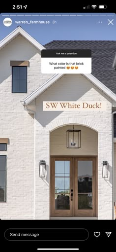 a white brick building with the words sww white duck on it's front door