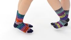 Colorful socks dance side by side in a fun way. Feet facing each other. Close-up and background in a white studio. The two women are having so much fun. E-commerce video. Commerce Video, Colorful Socks, Side By Side, E Commerce, Close Up, Two By Two, Siding, Socks, White