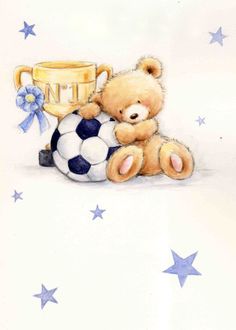 a teddy bear sitting next to a soccer ball with a trophy on it's back