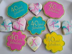 decorated cookies on a plate with the words 40 and fabulous