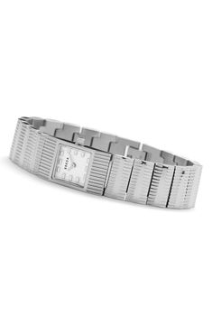 Contemporary minimalism distinguishes a luxe timepiece designed with a square case and textured bracelet for statement-making appeal. 16mm case; 16mm band width Self-adjustable bracelet with removable links Jewelry clasp closure Quartz movement Stainless steel Imported Modern Rectangular Watch With Stainless Steel Clasp, Elegant Silver Square Watch, Luxury Silver Square Watch, Silver Square Watch With Metal Dial, Metal Watch With Polished Finish, Rectangular Dial, Timepiece Design, Textured Bracelet, Jewelry Clasps, Adjustable Bracelet