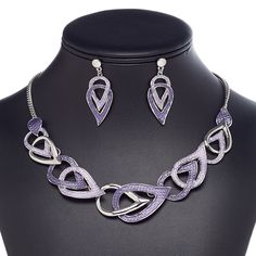 This ready-to-wear necklace with matching earrings is ideal for gift-giving, counter sales or extending current jewelry lines. Comfort clutch earnuts included. Colors, shapes and sizes may vary in each lot. Purple Teardrop Metal Jewelry, Silver Enamel Teardrop Jewelry, Purple Teardrop Metal Earrings, Silver Teardrop Metal Jewelry Sets, Nickel-free Purple Enamel Jewelry, Wear Necklaces, Lobster Claws, Necklace And Earring Set, Copper Necklace