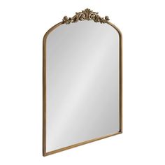 an ornate gold framed mirror on a white background with clippings to the bottom