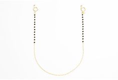 If you're looking for a subtle and classy piece, this chain is the one for you. The elegant gold loops and black spinal stone make for a delicate yet versatile combination. Whether you're going for a casual vibe or a fancy night out, this chain can be styled for any occasion. Gold Glasses, Black Gems, Glasses Chain, Black Spinel, Classic Gold, Delicate Bracelet, Gold Chains, Gold Chain, Are You The One