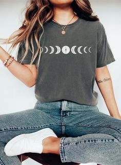 Moon Phase Shirt, Cute Boho Tee, Witchy Shirt, Mystic Moon Shirt, Astronomy Tee, Astology Lover TShirt, Celestial Tshirt, Birthday Gift Greetings and a warm welcome to our shop! We're thrilled to have you here, and your presence brightens our day! 😊  SIZING ❤  - Please refer to size chart on the listing photos for a detailed sizing chart with measurements. - Unisex sizing. - If you are seeking an oversize look be sure to order 1 to 2 sizes up from your regular size. - Since all shirts are made Cotton Crew Neck Top With Moon Print, Trendy Moon Print Crew Neck Top, Relaxed Fit Graphic Tee With Moon Print, Trendy Crew Neck T-shirt With Moon Print, Relaxed Fit Moon Print Graphic Tee, Trendy Crew Neck Top With Moon Print, Graphic Tee Shirt With Moon Print, Bohemian Short Sleeve T-shirt With Moon Print, Trendy Cotton T-shirt With Moon Print