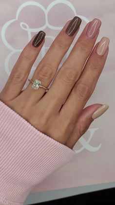 a woman's hand with two different manies and one diamond ring on it