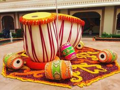 an elaborately decorated floor with musical instruments and decorations in front of a large building