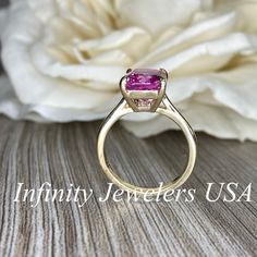 "The ring pictured is lab created sapphire #6419 Video shown in 14k white gold -Approximate total carat weight: 3.90ctw. diamond equivalent -Center Stone Size: approx. 3.90ct diamond equivalent -Center Stone Shape: radiant cut 10x8 mm -Gem Type: lab created pink sapphire -Stone Clarity: VS2 -Stone Color: pink -Moh's Scale: 9 hardness -Metal Type and Purity: 14k yellow gold -Setting: Claw Prong Brasket Head -Stock Ring Size: 6 -Country of Manufacturing: USA (Michigan) For customization please con Pink Sapphire Ring With Center Stone For Anniversary, Anniversary Pink Sapphire Ring With Center Stone, Pink Sapphire Emerald Cut Ring For Anniversary, Emerald Cut Pink Sapphire Ring For Anniversary, Gia Certified Classic Pink Sapphire Jewelry, Classic Gia Certified Pink Sapphire Jewelry, Cushion Cut Pink Sapphire Rings For Anniversary, Pink Sapphire Cushion Cut Rings For Anniversary, Anniversary Pink Sapphire Fine Jewelry Ring