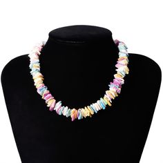 Strung on a 38 cm chain, this colorful piece is made up of different clam chip fragments painted with a mix of pastel colors. Each piece is set in either a lovely pink, ocean blue, golden yellow, or pearly white, or another beautiful pastel shade. Each piece is jaded and unique, making the entire necklace give off a natural appeal. This Innovato Design necklace ends with a stainless steel lobster claw clasp and a 7 cm extender link chain. The extender chain allows the wearer to adjust the length of the necklace.  Product Highlights    Made from natural clam chips  Multicolor Pastel Design  Durable lock and clasp Multicolor Shell-shaped Jewelry For Gifts, Multicolor Shell-shaped Jewelry Gift, Multicolor Shell-shaped Necklace For Gift, Multicolor Shell Necklace For Gift, Multicolor Shell-shaped Necklaces For Beach, Multicolor Shell-shaped Necklace For Beach, Multicolor Handmade Shell Necklaces, Handmade Multicolor Shell Necklaces, Multicolor Shell Shaped Beaded Necklaces