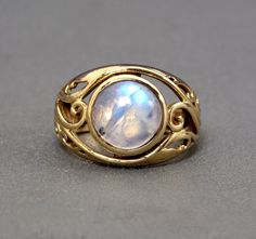 "Handmade item Product :- ring Material :- brass, sterling silver  💎 The gemstone is the MOONSTONE. ✦ Moonstone is a stone that brings hope, enhances feminine energies, sensitivity, intuition, and psychic abilities. It is also said to bring strong energies of abundance to one's life.Moonstone is a stone of protection, especially during childbirth, pregnancy, and travel at sea. It is a stone of calm and relief from emotional stress. Moonstone is birthstone of June. 💎 The natural gemstone can va Gold Round Mystical Moonstone Ring, Handmade Gold Moonstone Ring In Sterling Silver, Gold Moonstone Birthstone Ring, Brass Moonstone Ring, Round Brass Moonstone Ring, Mystical Gold Moonstone Ring, Gold Mystical Moonstone Ring, Spiritual Brass Moonstone Gemstone Ring, Handmade Gold Spiritual Moonstone Ring