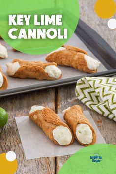 some food is laying out on a tray with the words key lime cannoli