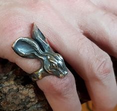 Sterling silver Hare ring. This is a real statement ring! Really stunning on the hand and works well for a man or a woman. Original design carved in wax then lost wax cast into solid sterling silver. Large piece which weighs approximately 25g. Also available oxidised/blackened as shown in photograph. Shown in a size P, and adjustable to ring sizes A-Z6 (£10 supplement charged for sizes T and larger). First class post included. Unique Hand Cast Sterling Silver Engraved Ring, Unique Collectible Engraved Ring With Lost Wax Casting, Unique Engraved Ring With Lost Wax Casting For Collectors, Unique Hand Forged Engraved Ring For Gift, Unique Sterling Silver Engraved Ring, Unique Handmade Open Engraved Ring, Unique Handmade Engraved Collectible Ring, Handmade Unique Engraved Collectible Ring, 15 Rings