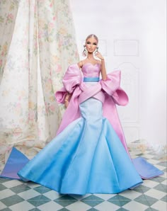 a barbie doll wearing a blue and pink dress