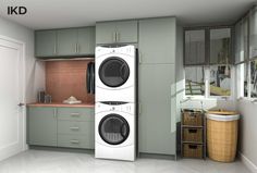 a laundry room with two washers and a dryer