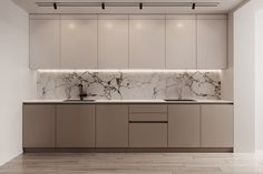 an empty kitchen with marble counter tops and cabinets