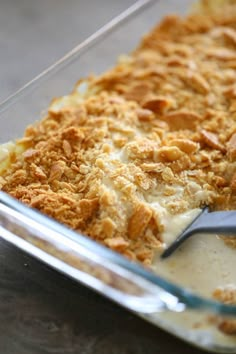 a casserole dish with some food in it and a spoon next to it