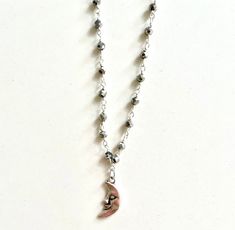 * Silver Pyrite Hydro Faceted Rondelle Beaded Rosary Chain with subtle sparkle * With or without a silver crescent moon charm * chain and charm are both sterling silver plated  * Necklace length: 15 inches with extension chain (can be worn as a choker or necklace) * trendy / indie / vintage / y2k / retro / aesthetic / rosary / 90s / unique / everyday / dainty / minimalist * free shipping over $35 * comes with a free sticker * ig: @jewelry.by.marina * please feel free to message me with any questions or customization requests! <3 Silver Celestial Crystal Necklace With Moon Charm, Silver Crescent Crystal Necklaces For Jewelry Making, Silver Necklace With Moon Charm And Round Beads, Silver Crescent Crystal Necklace In Celestial Style, Silver Spiritual Crystal Necklace With Moon Charm, Silver Crescent Crystal Necklace Celestial Style, Dainty Silver Beaded Charm Necklaces, Spiritual Silver Crystal Necklace With Moon Charm, Dainty Silver Beaded Charm Necklace