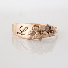 The Stargazer Lily floral ring is a row of dainty flowers wrapped around your fingers. This item is engravable with text or monogram of your choice at no extra cost. The initals are engraved into the underside or on the outside of the ring and embedded in the 3D model for a flawless embossed finish. You are welcome to sketch out your own design too, if you prefer. Please contact me if you would like to customize this ring with different flowers (custom order fees apply). Engraving is available o Jewelry Reference, Infinity Bracelets, Victorian Style Rings, Lily Ring, Dainty Flowers, Sunflower Ring, Silver Springs, Stargazer Lily, Engraved Initials