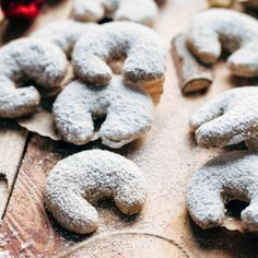 powdered sugar donuts on a wooden table