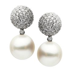 This heavenly set of earrings feature South Sea pearls of exceptional quality, adorned with 144 shimmering diamonds, weighing over 2 carats total. At 12-13mm, the pearls show off natural luminescence when paired with brilliantly sparkling diamonds. 18K White Gold South Sea Pearls - 4.2 grams, 12-13mm 144 Diamonds - 2.30ct South Sea Pearls Earrings, Contemporary Earrings, Pearl And Diamond Earrings, Diamond Earring, Sea Pearl, Sea Pearls, South Sea Pearls, Women Diamond, Yellow Gold Earring