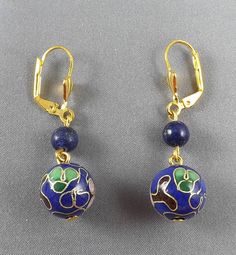 "- Materials:  10mmX10mm blue Cloisonne beads, Lapis Lazuli gemstone beads. - Length: 1.\" - Closure: Golden plated leverback hooks, nickel free, lead-free" Handmade Royal Blue Round Beads Jewelry, Nickel-free Blue Round Bead Jewelry, Sapphire Jewelry With 8mm Beads As Gift, Blue Lapis Lazuli Jewelry With Ear Wire, Sapphire Jewelry With 8mm Beads, Blue 8mm Beads Jewelry For Gift, Blue 8mm Bead Jewelry For Gift, Blue Jewelry With 8mm Beads As Gift, Blue Round Beads Earrings For Jewelry Making