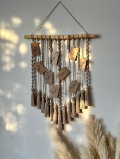 a wind chime hanging from the side of a wall