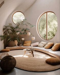 a living room filled with furniture and round windows