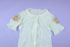 "Prairie Cottage Core Embroidered Flowers 1970's Vintage Blouse, size 42, please see measurements. Great condition. Measurements: (Please note measurements are taken flat, across the surface. Best to compare to a garment you already own that fits to your liking). Pit to Pit: 19.5\" Collar to bottom: 20.5\" I do my best to describe all items accurately. All items are sold in As-Is condition. Please keep in mind these are used vintage pieces so there will be age-appropriate wear unless noted deadstock. Feel free to contact me if you have any questions! No refund, no returns." Retro Floral Embroidered Summer Tops, Retro Summer Tops With Floral Embroidery, Vintage Blouse With Floral Embroidery For Daywear, 1970s Cotton Blouse For Spring, 1970s Style Cotton Blouse For Spring, Vintage Floral Embroidered Blouse For Spring, Fitted 1970s Style Summer Blouse, Fitted Vintage Tops With Floral Embroidery, Fitted Blouse 1970s Style For Summer