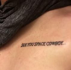 a man with a tattoo saying see you space cowboy on his back side ribcage