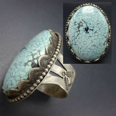 "ELGIN TOM NAVAJO RING DESCRIPTION: This spectacular ring is from celebrated Navajo artisan Elgin Tom. A gorgeous specimen of #8 turquoise is secure in hand-stamped scalloped bezel on a foundation of heavy gauge sterling silver. The wide, hand-stamped band holds this beauty perfectly in place on your finger. This extraordinary ring will be a treasured addition to your collection of fine Native American jewelry. MEASUREMENTS: Ring face measures 1 5/8\" x 1 1/4\" Cabochon measures 37mm x 27mm RING