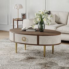 a coffee table with flowers on top in a living room