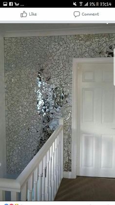 a white door sitting next to a window in a room with tile on the walls