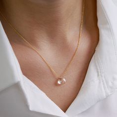 "A delicate rock crystal necklace is made to highlight Your Beauty. High-quality, flawless clear crystal quartz is neatly centered on the classic yet strong chain in the metal type and the length of your choice. Great as a gift for your beloved one on an April birthday or 10th Anniversary for your wife. Matching earrings: https://etsy.me/2lBd83i MATERIALS: * natural rock crystal (clear quartz) * tiny rondelles at the chain ends (except 14k Gold) * available 14k Gold Filled, Sterling Silver, 14k Rose Gold Crystal Necklace With Delicate Chain, Elegant Everyday Crystal Necklaces, Rose Gold Delicate Chain Crystal Necklace, Elegant Rose Gold Crystal Necklace With Round Pendant, Modern Clear Necklaces For Gifts, Modern Clear Necklace For Gift, Elegant Quartz Pendant Necklace, Minimalist Clear Gemstone Jewelry, Elegant Rose Gold Crystal Necklace With Delicate Chain