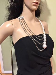 "This unusual, interesting, elegant, feminine, and classy pearl necklace has been designed and made by Mirela Skikic - USA. This complex necklace is made of white glass pearls on silver metal wire that can be adjusted to the position on your chest as you like. It closes with a silver color lobster clasp. It looks very elegant with any type of formal and casual outfit. It also can be a nice wedding accessory. It can be combined with other pieces from my \"Pearl Madness\" collection, which also ca Party Pearl Chain Necklace With Pearl Charm, Pearl White Chain Pearl Necklace For Party, Long Pearl Pendant Necklace For Parties, Party Pearl Charm Chain Necklace, Pearl Chain Necklace With Pearl Charm For Parties, Elegant Pearl Pendant Chain Necklace For Party, Pearl White Pearl Necklace With Chain For Party, Pearl White Necklace With Chain For Party, Elegant White Pearl Chain Backdrop Necklace